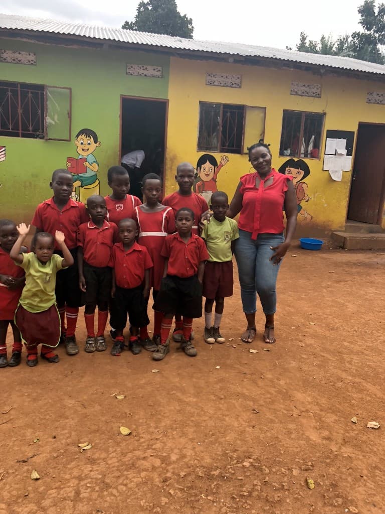 An old picture of Dr. Josephine with the kids in primary and nursery