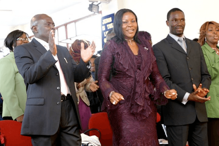 Dr. Josephine and Peter Kyambadde worshiping