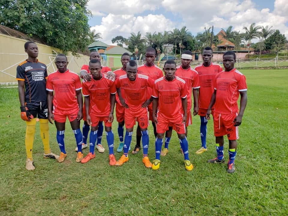 Samson and his teammates in red uniforms
