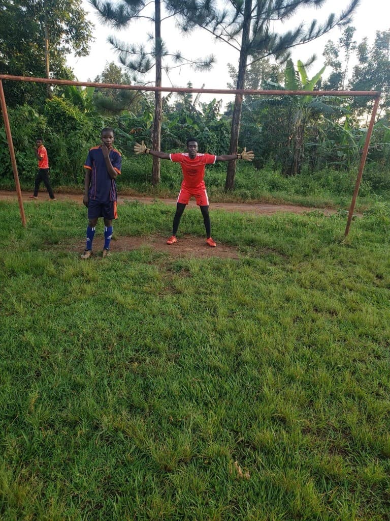 Samson with Mathew Sekanjako on the field